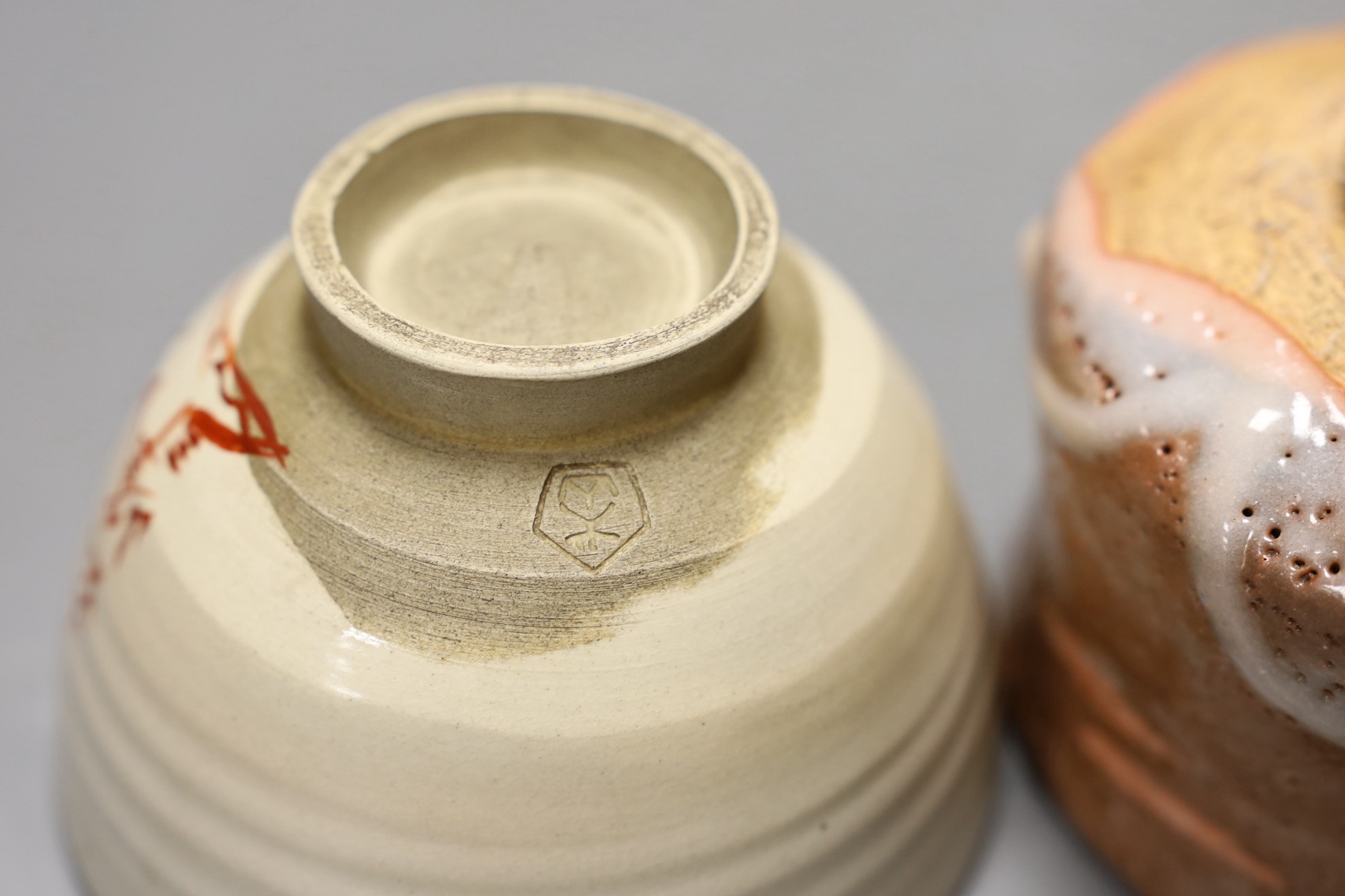 Two Japanese studio pottery chawan tea bowls, one with raku glaze, 12cm diameter